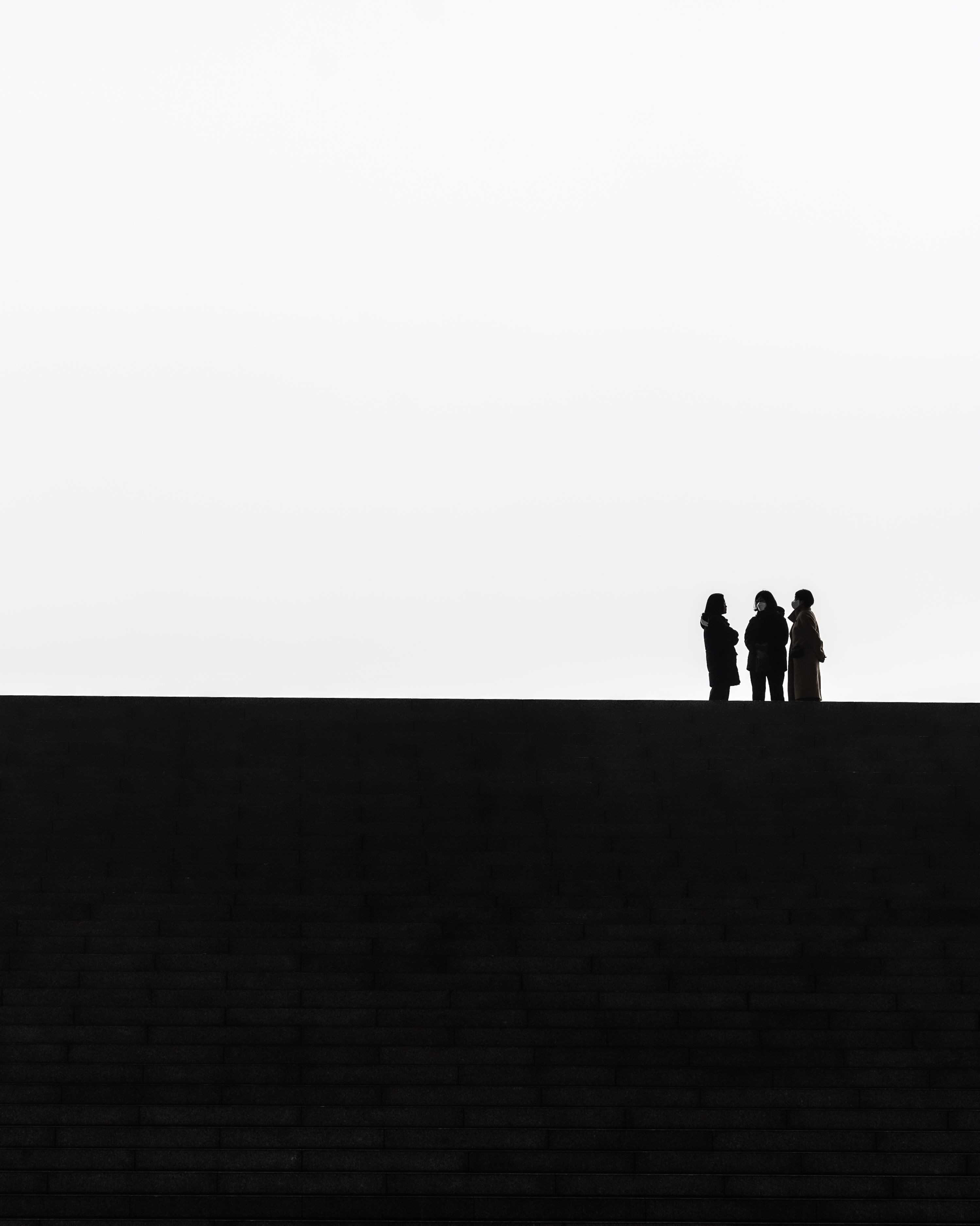 Three colleagues comparing how a business process works